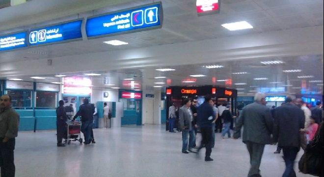 People gather during a nationwide strike against the government's refusal to raise wages in Tunis