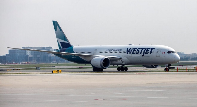 FILE PHOTO: A WestJet Boeing 787-9 Dreamliner airplane taxis along a runway at Toronto Pearson Airport in Mississauga, Ontario, Canada